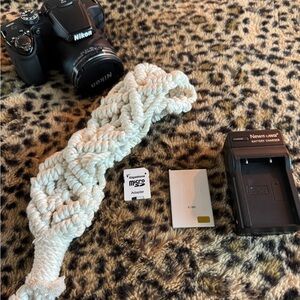 Nikon Black Camera with White Accessories